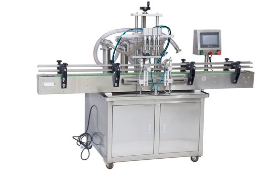 Picture of 4 heads Automatic liquid filling machine with conveyor PLC control by sea