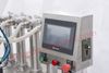 Picture of 4 heads Automatic liquid filling machine with conveyor PLC control by sea