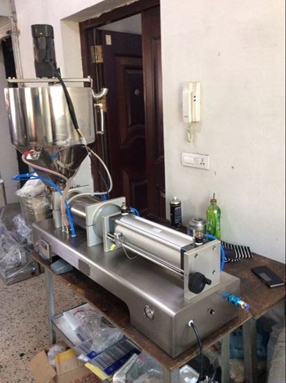 Picture of paste filling machine with the heated and mixer hopper 15-150ml
